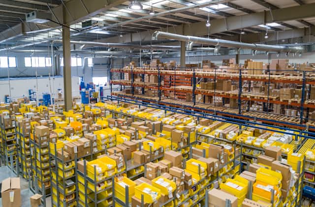 A warehouse aisle, quiet between shifts.
